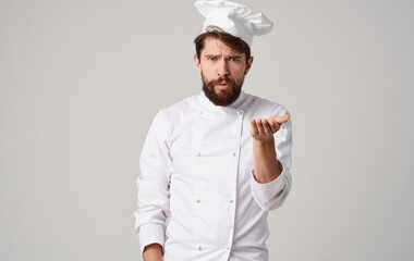 male chef uniform headdress light background cropped view