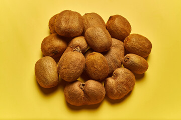 Kiwis on yellow background