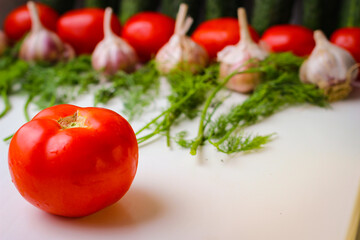 Good organic cucumbers and red tomatoes and garlic