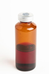 Macro Image Of Amber Vaccine Vial In White Background
