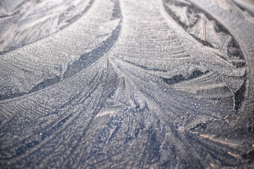 Abstract winter pattern of ice on glass. Winter ice patterns on window.