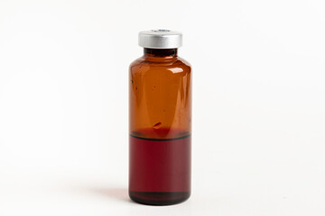 Macro Image Of Amber Vaccine Vial In White Background