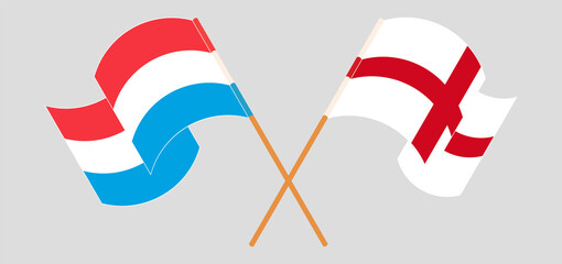 Crossed and waving flags of Luxembourg and England
