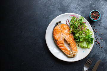 fresh salmon fried fish in a plate grilled seafood omega ready to eat on the table for healthy meal snack outdoor top view copy space food background rustic image pescetarian diet