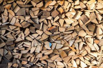 Pile of chopped fire wood prepared for winter	
