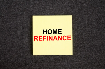 Yellow sticker on the dark gray texture background with text Home Refinance