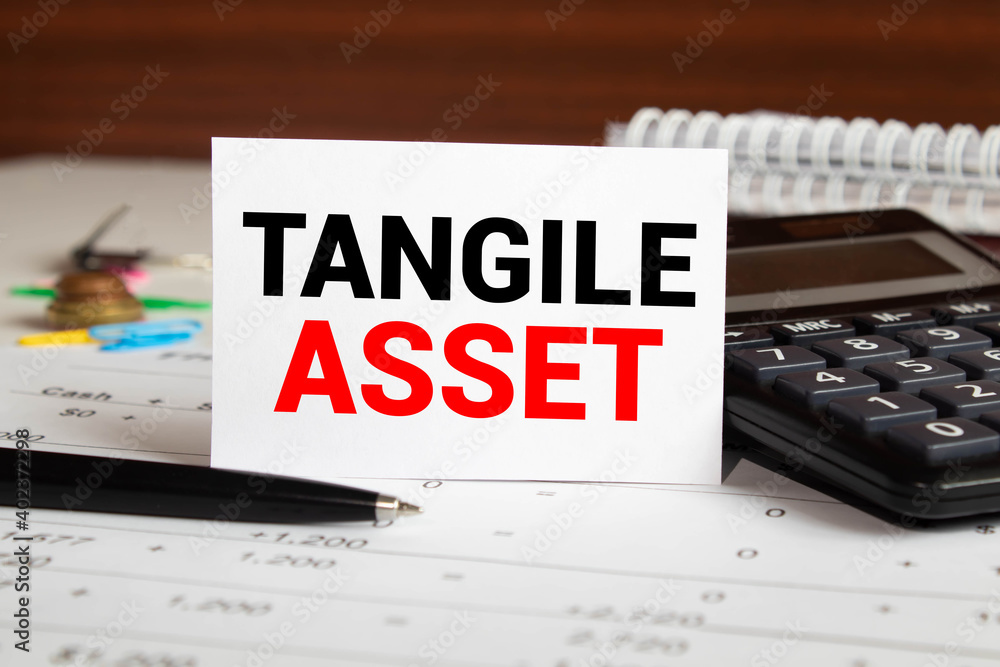 Poster tangible asset text written on a notebook with pencils