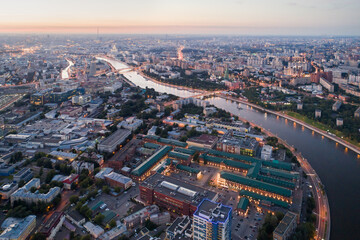 The big city and the river at sunset in the summer. Danilovsky District, Southern Administrative District, Moscow, Russia - 402372655