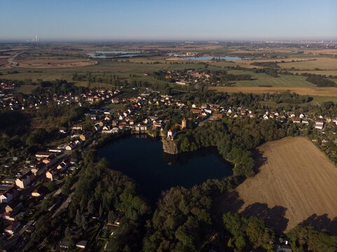 Aerial view of heart shaped lake Kirchbruch See with mountain chapel church Bergkirche Beucha in Brandis Leipzig Saxony