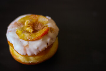 Delicious Donuts with apple and cinnamon on a black background