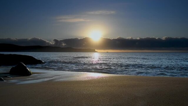 Sunrise lights up at the beach. Taken at Pearl Beach, NSW, Australia.
