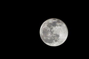 Wolf Moon. Super full moon with dark background. Madrid, Spain, Europe. Horizontal Photography. 25....