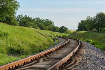 The railroad winds between the hills, concept life