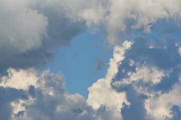 white fluffy clouds in the blue sky