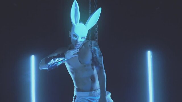 Sexy man dancing in a rabbit mask