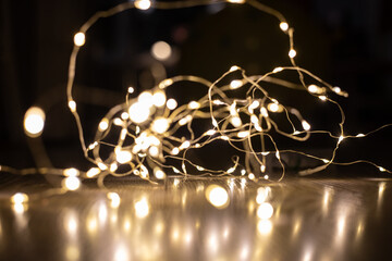 
garland on the floor with beautiful bokeh and reflection