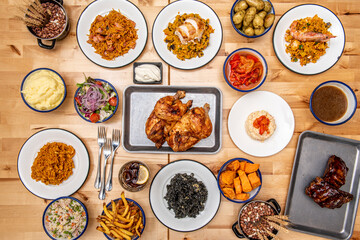 overhead shot with dishes of Spanish rice and roast chicken