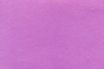 Clean purple retro paper background. Vintage violet cardboard texture. Grunge paper for drawing. Simple blank fabric pattern.
