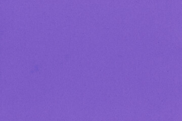 Clean purple retro paper background. Vintage violet cardboard texture. Grunge paper for drawing. Simple blank fabric pattern.
