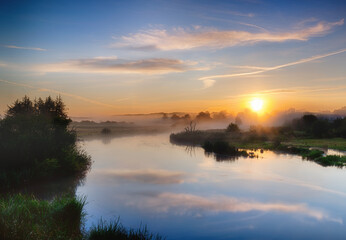 Fototapeta na wymiar Sunrise over the river,