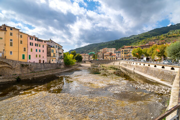 An empty river bed along the Val Nervia River in the medieval city of Dolceacqua, Italy, in the Imperia Liguria region.
