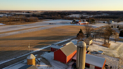  Establishing shot of Midwestern countryside in winter.  Aerial view of  rustic road, farm houses,...