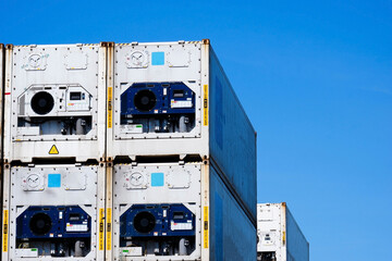 Stacked containers in a shipping terminal