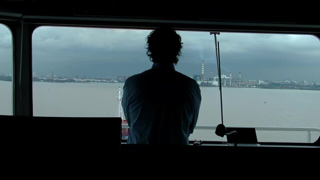 Pilot Standing on Container Ship Bridge Looking at Buenos Aires Port, Argentina