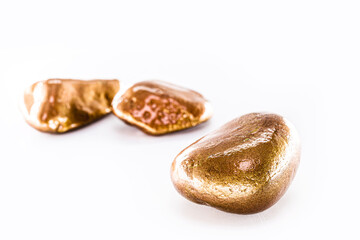 gold stone isolated on white background, macro photography of rock, mineral extraction