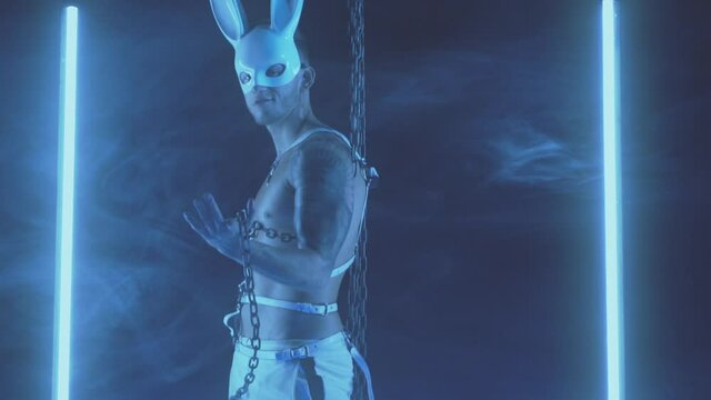 Sexy man dancing in a rabbit mask