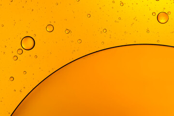 Golden bubbles. Yellow circles. Abstract background. Bubble oil on water. Macro-photography.