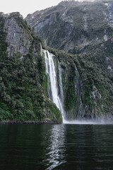 Stunning waterfall in Milford Sound. Fiordland National Park, New Zealand