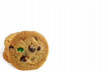 traditional homemade chocolate chip,candy,oatmeal cookies isolated closeup on white background with copy space