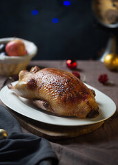 Crispy roasted Duck on a white plate ready for serving