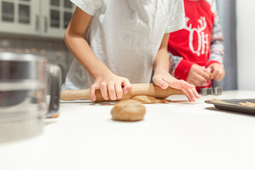 happy family funny kids are preparing the dough, bake cookies in the kitchen