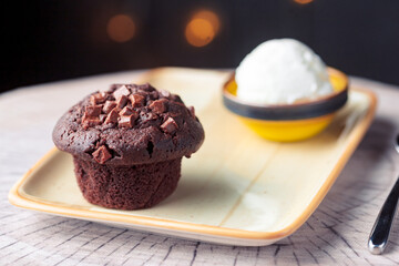 delicious chocolate cake and ice cream on a yellow plate