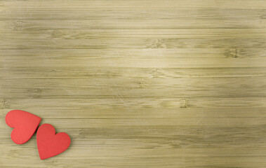 red wooden hearts on wooden background