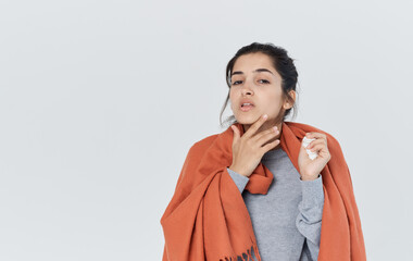 Woman with orange forehead on her shoulders holding a napkin in her hand health problems cup of tea cropped view