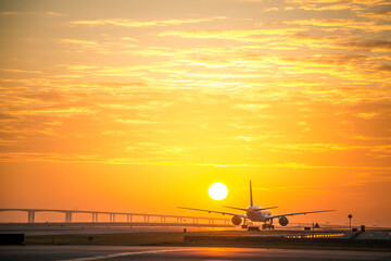 Hong Kong, 28 Dec,2020, Cathay Pacific airplane taxiing to runway with sunset background