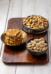 Sesame seed cake or candy, peanuts chikki with roasted peanuts for the celebration of Indian festival Lohri