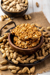 Sesame seed cake or candy, peanuts chikki with roasted peanuts for the celebration of Indian festival Lohri