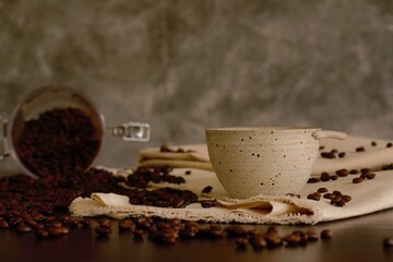 Coffee cup with coffee beans background, warm mood, and tone