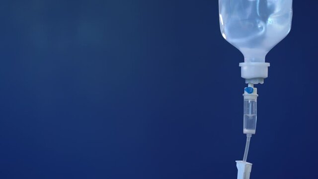 Closeup of IV drip in hospital, Intravenous saline solution, IV loading dose.