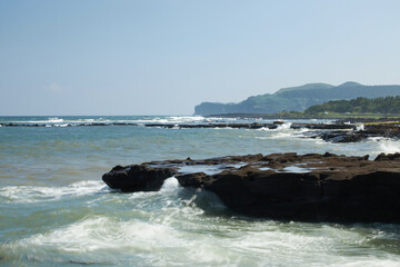 waves crashing on rocks