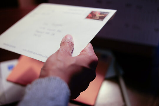 Person holding a Letter