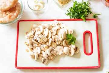 Fresh organic mushrooms sliced on the board, ingredients, meal preparation 