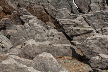 Close view of the Pancake rocks an unusual geological formation of sedimentary rocks in New Zealand's South Island.