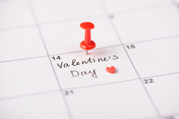 Waiting for St Valentines day concept. Close up photo of calendar with marked date with drawing red...