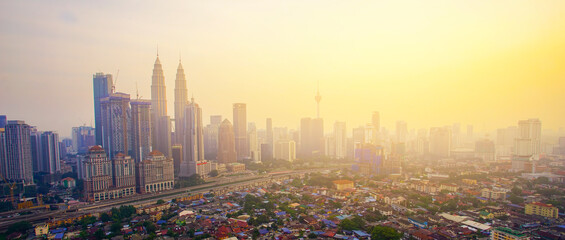 Obraz premium Aerial panoramic view of Kuala Lumpur city during sunrise.