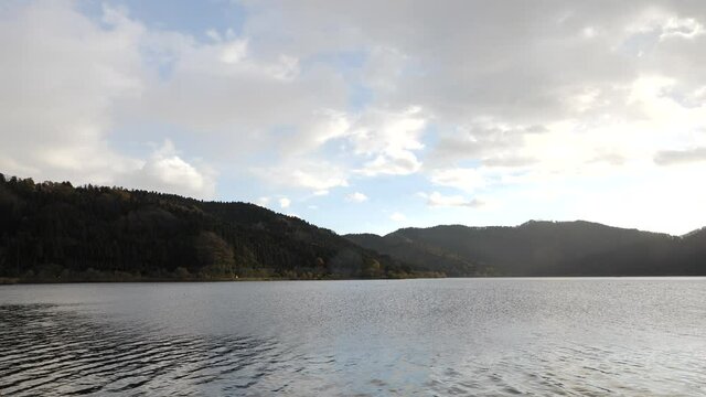 A view of Lake Yogo taken in autumn under a light rain.